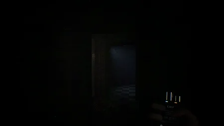 First person view of a dark doorway with EMF detector in FNAF Urbex