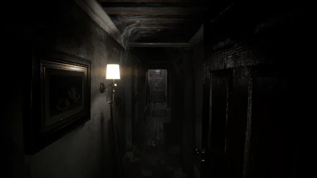 Lower hallway in Shadows Awaken with a lit wall lamp and deteriorating walls